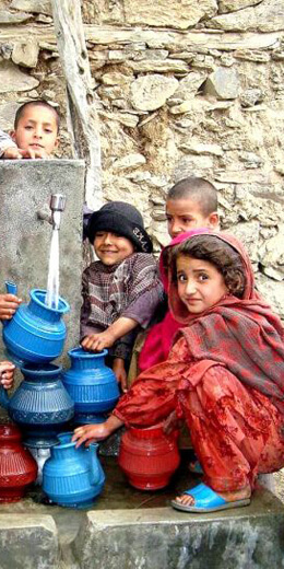 children-in-nawa-village-afghanistan-fill-their-containers-with-fresh-running-water